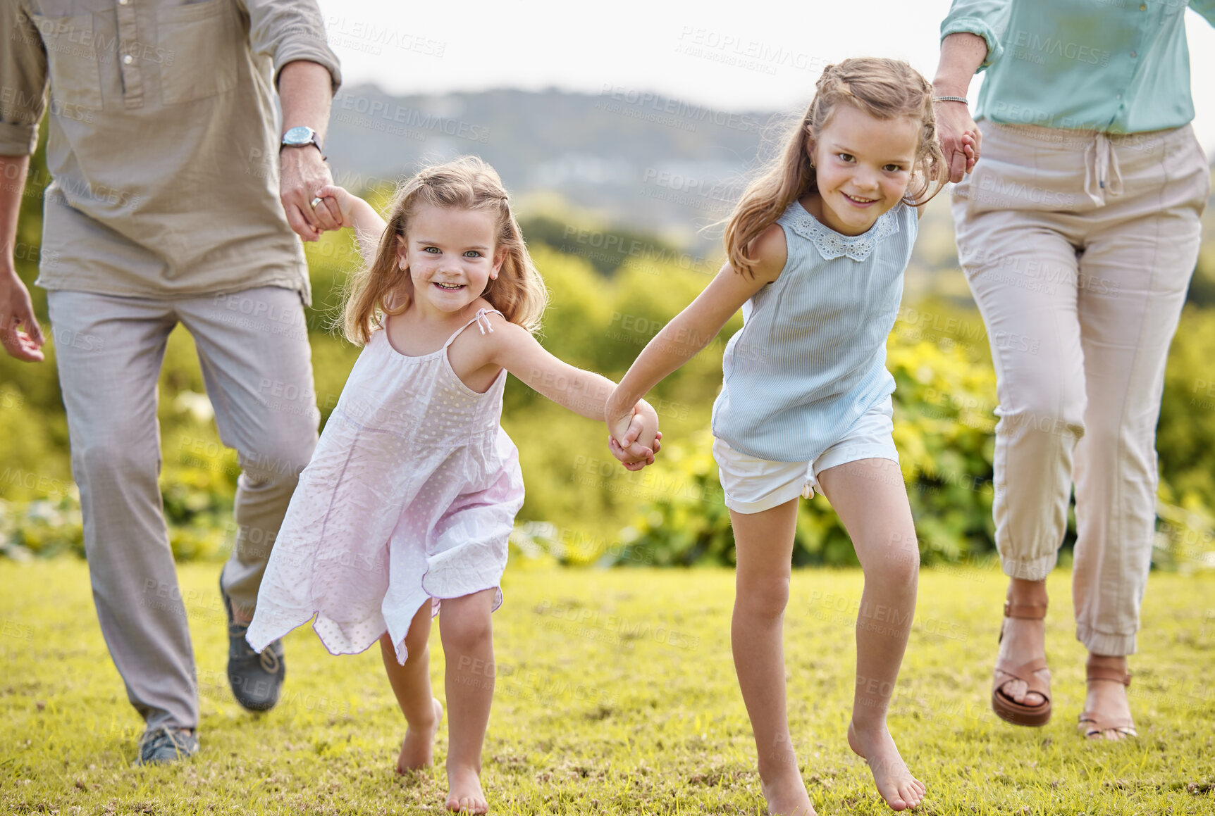 Buy stock photo Parents, holding hands and portrait of girl children with smile, outdoor fun and weekend morning bonding together. Mom, dad and kids running in garden for happy family, relax and love in nature.