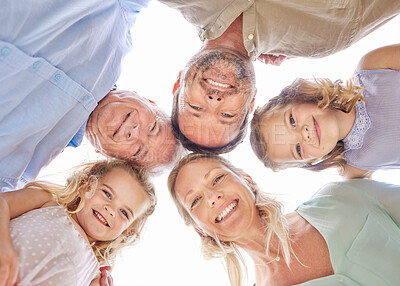 Buy stock photo Shot of a family of four standing together in a huddle