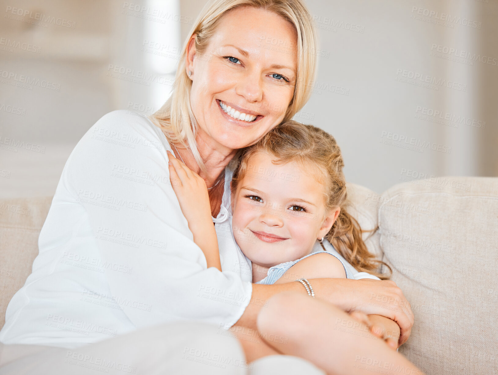 Buy stock photo Mother, portrait and girl on sofa for hug, bonding and love in home with support, care and trust. Family, daughter and happy on couch in living room for embrace, relax and smile on weekend with face