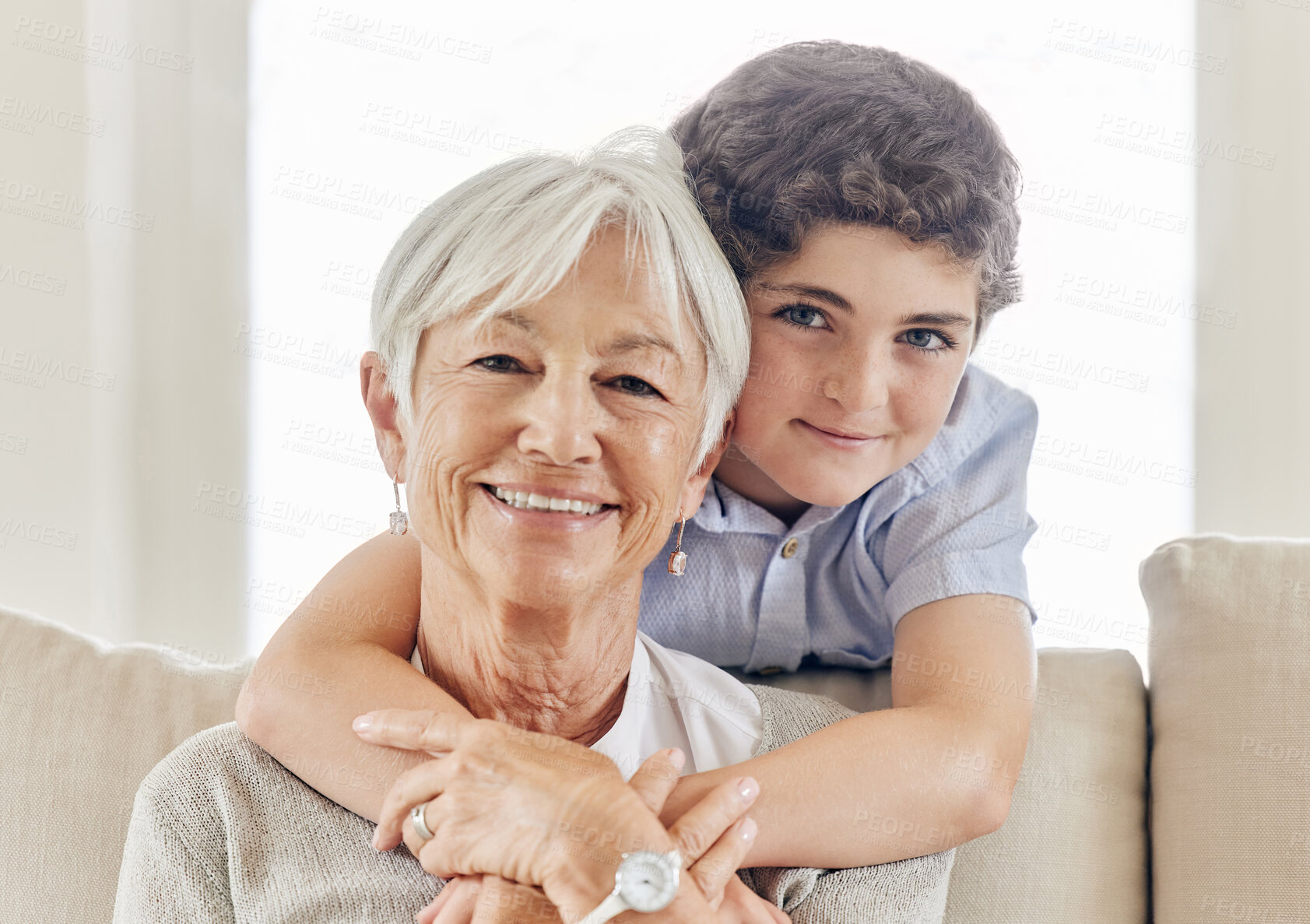 Buy stock photo Hug, grandmother and child in home portrait, old woman and boy for bonding on couch. Together, support and grandma with son in embrace for love, Berlin and security in connection on weekend visit