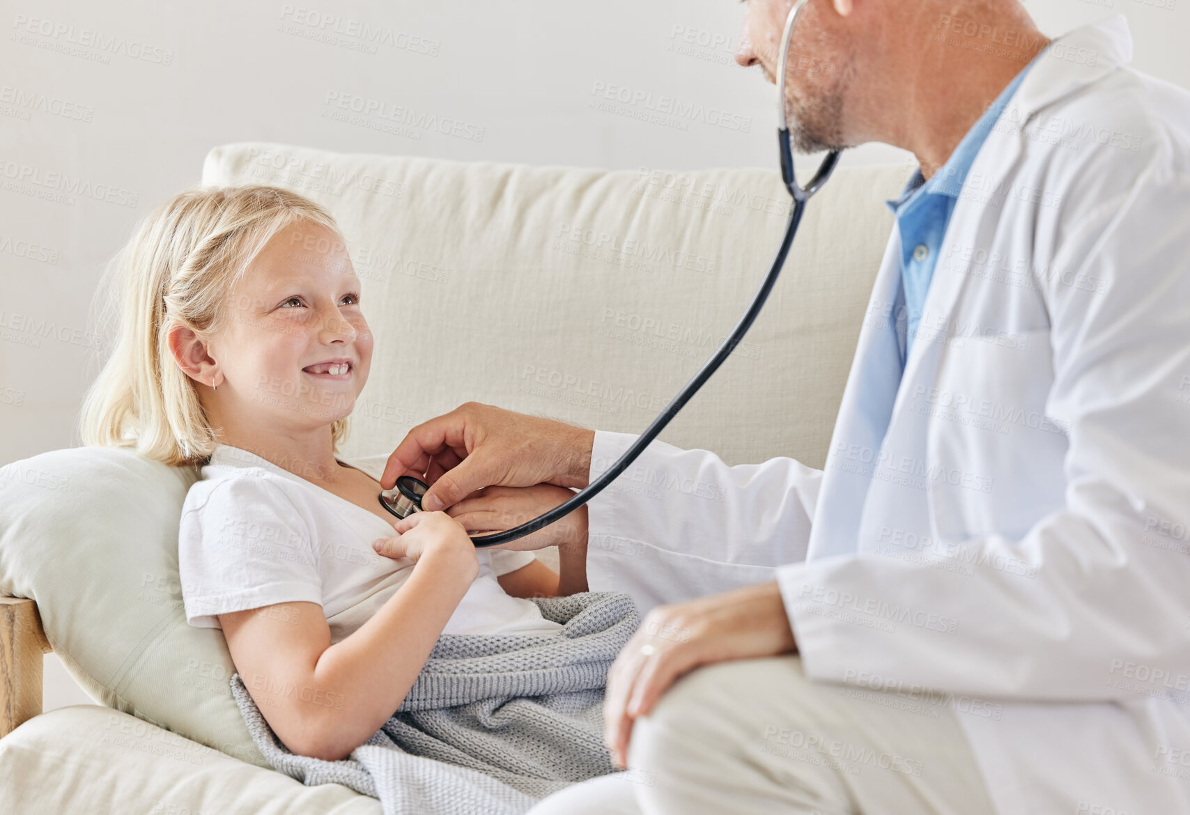 Buy stock photo Child, stethoscope and doctor in home for wellness, help and healthcare treatment in lounge. Young, female person and medic in house for happiness, heartbeat and service in medical appointment as kid