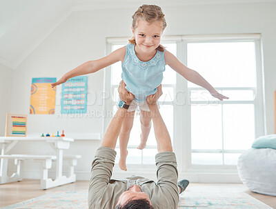 Buy stock photo Shot of a father bonding with daughter at home
