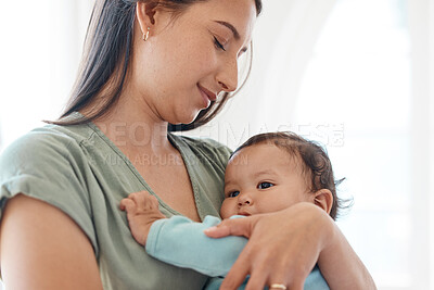 Buy stock photo Mother holding baby in arms for love, care and quality time together to nurture childhood development at home. Mom carrying infant girl kid, young child and newborn for support, comfort and childcare