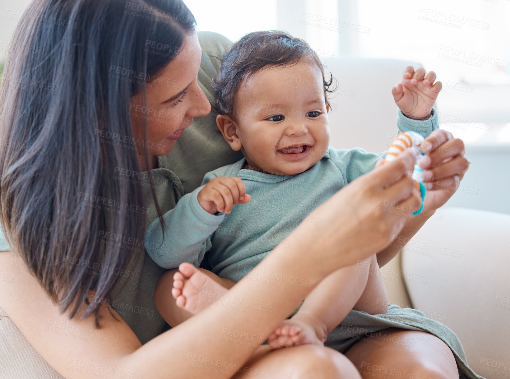 Buy stock photo Happy baby, mother and rattle for play, educational development and sensory growth of child care at home. Mom, newborn girl and smile with toys for happiness, fun learning and relax in kids nursery