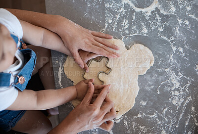 Buy stock photo Shot of a woman baking cookies with her toddler at home