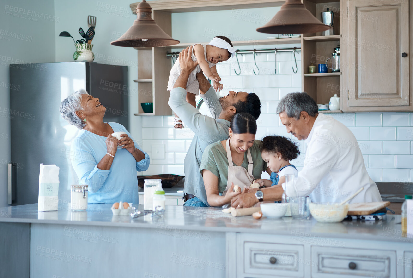 Buy stock photo Generations, big family and kids in kitchen, baking and bonding together with happiness. People, house and grandparents with mother, father and children with ingredients, recipe and hobby for fun