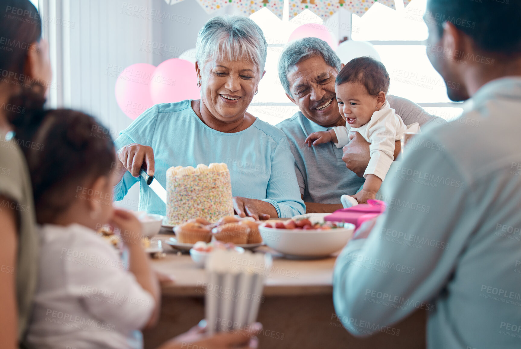 Buy stock photo Big family, mature couple and birthday cake with laugh, celebration and love for home party. Senior man, woman and grandparents with children, support and event for retirement and holiday bonding