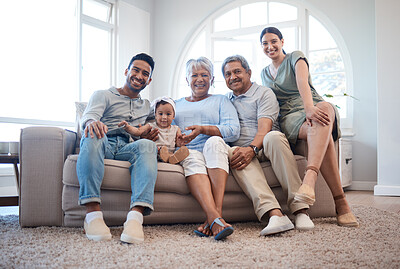 Buy stock photo Shot of a family spending time together on a sofa at home