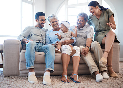 Buy stock photo Shot of a family spending time together on a sofa at home