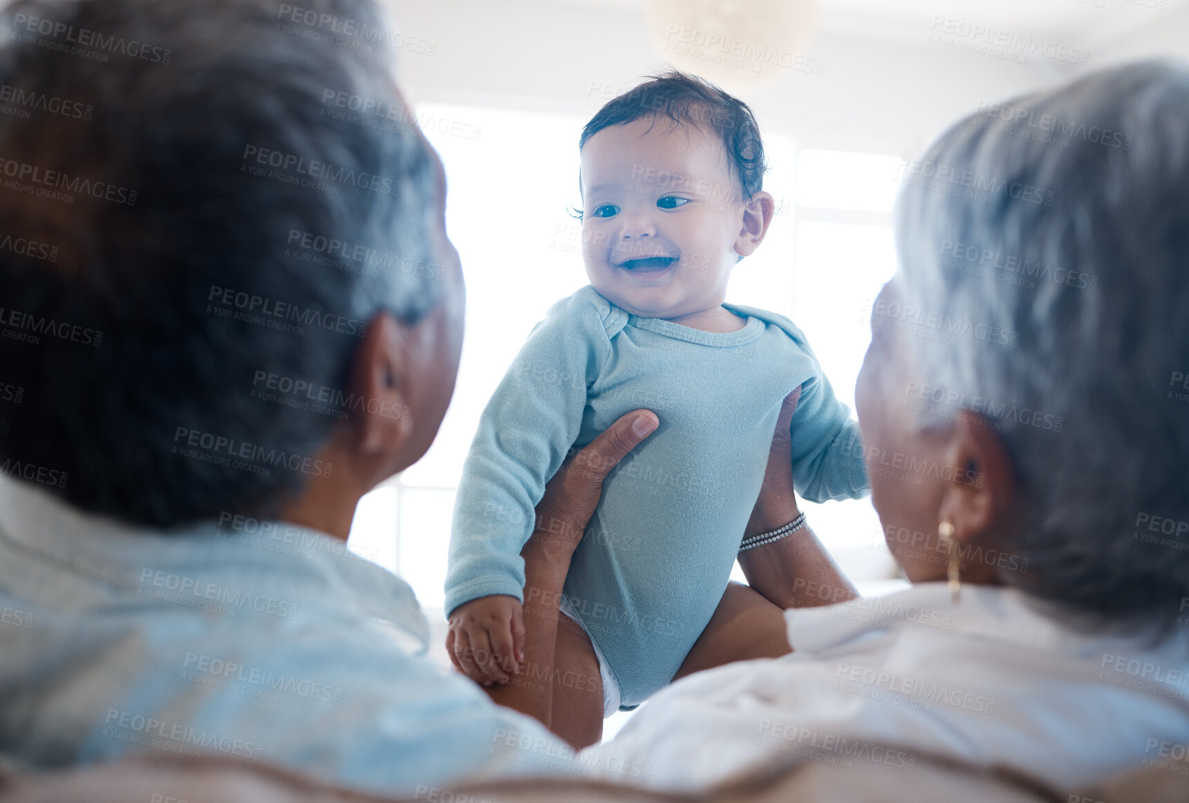 Buy stock photo Happy, grandparents and holding baby at house with love, family support and bonding together of care. Smile, people and infant for communication, playful security and child development of visit break