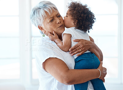 Buy stock photo Love, kiss and grandmother with child in a living room for bonding, hug and playing in their home. Kissing, family and senior female enjoying retirement with grandchild, babysitting and hugging