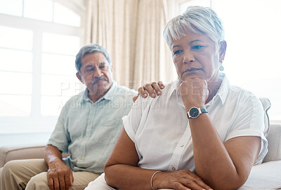 Buy stock photo Shot of a senior man consoling his sad wife at home