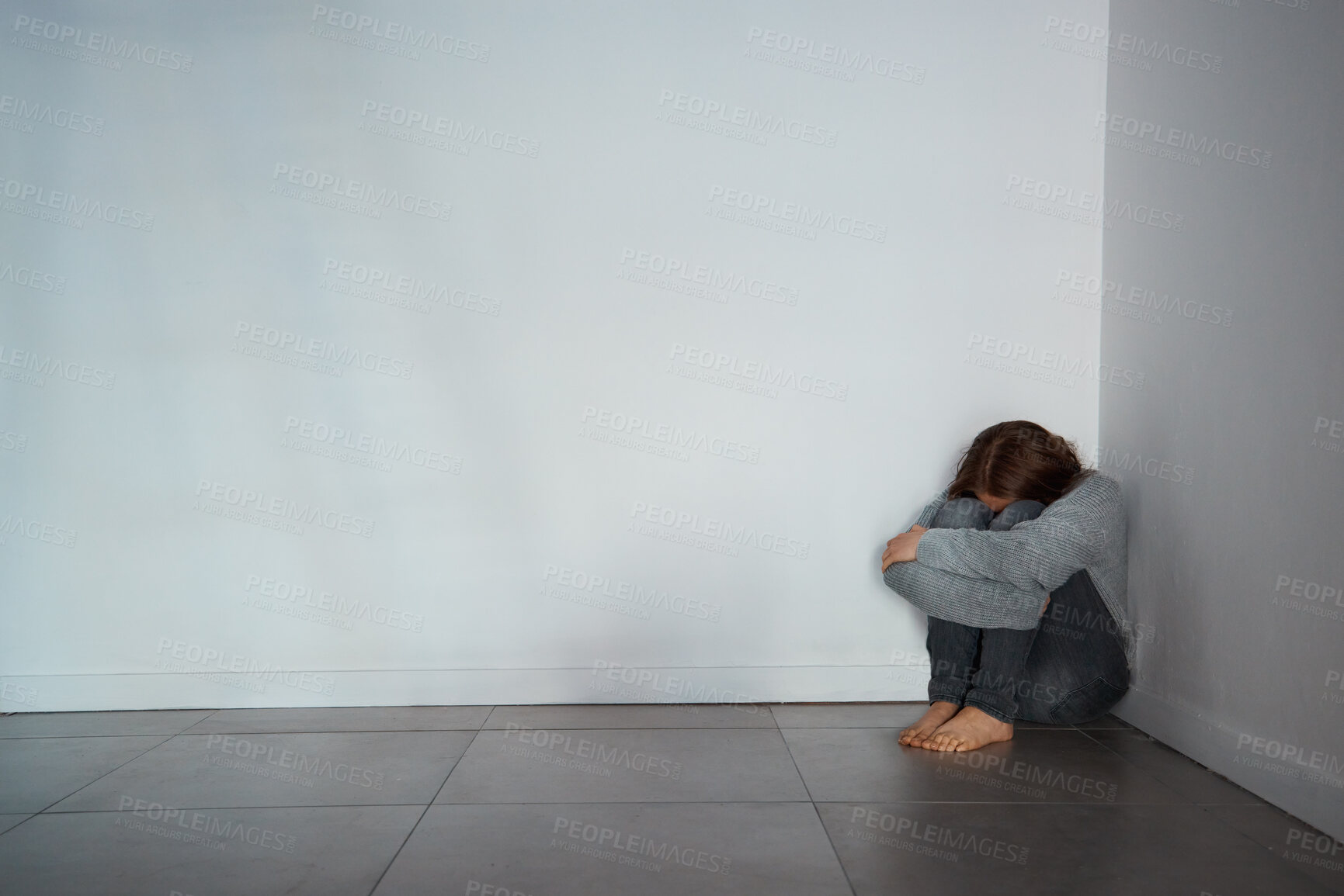 Buy stock photo Room, corner and woman with crying for depression, abuse and mental health with emotions on floor. Mockup space, female person and victim with anxiety for isolation, violence and loneliness in house