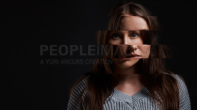 Buy stock photo Studio shot of a woman posing against a dark background with a distorted face