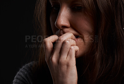 Buy stock photo Cropped shot of a woman biting her fingernails