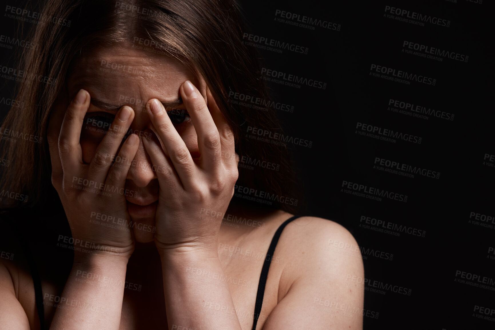 Buy stock photo Cover, space and woman in studio or fear for domestic violence, trauma anxiety and terror in dark. Horror, nervous or scared abuse victim with depression, danger mockup or stress on black background