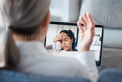 Buy stock photo Shot of an unrecognisable psychologist sitting and using a laptop for an online consultation with her patient