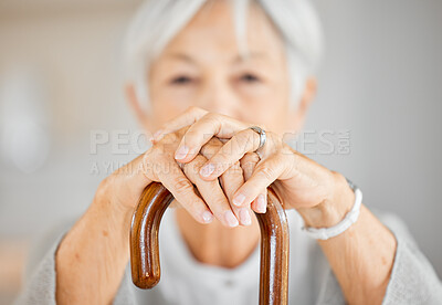 Buy stock photo Closeup shot of a senior woman holding a walking stick