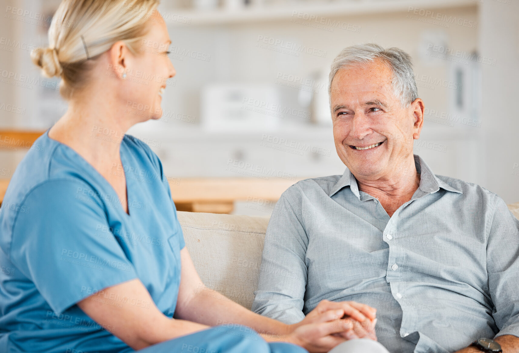 Buy stock photo Shot of a nurse caring for a senior man at home