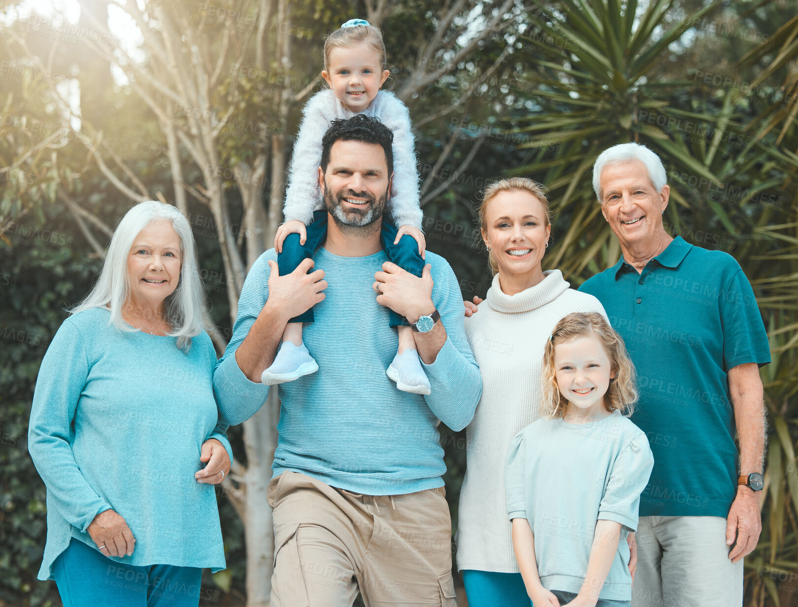 Buy stock photo Big family, children and parents piggyback in garden with games, fun and excited for bonding, love and support. Portrait of mother, father and kids playing in nature, park and outdoor for adventure