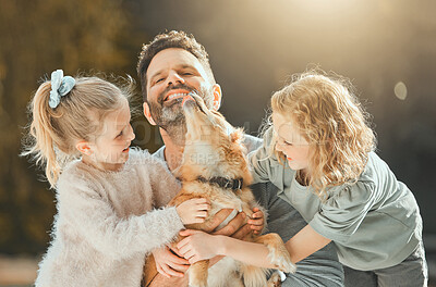 Buy stock photo Shot of a man spending time outdoors with his two daughters