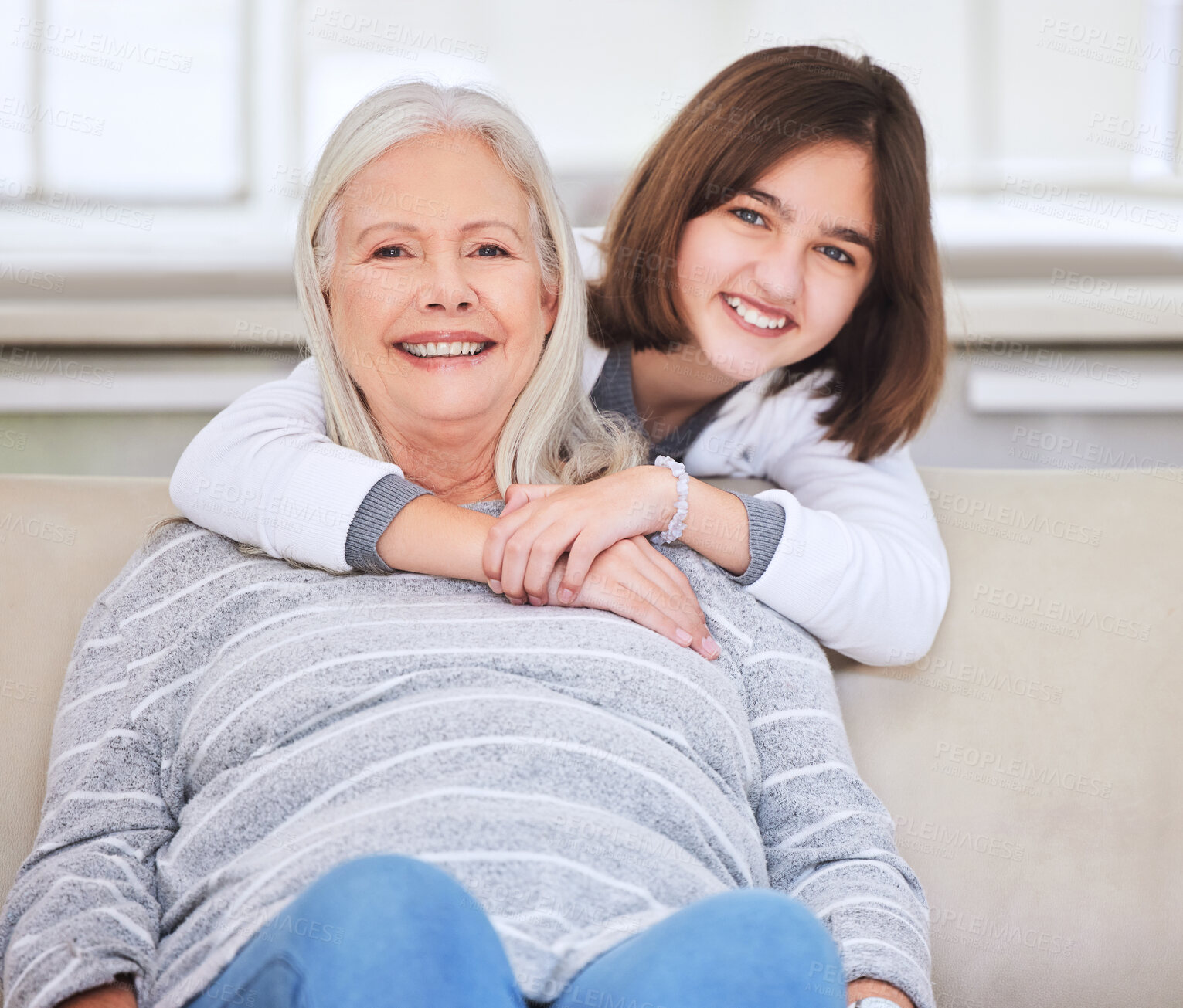 Buy stock photo Portrait, hug and grandmother with happy teen in home for love, support and family bonding. Face, kid and girl embrace with grandparent for connection, trust and generations relax together in Canada