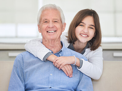 Buy stock photo Shot of a mature man bonding with his grandchild on a sofa at home