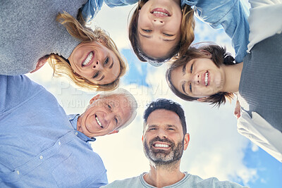Buy stock photo Shot of a family huddling together at home