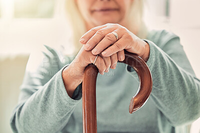 Buy stock photo Relax, cane and hands of senior woman on sofa with memory, nostalgia and support in nursing home. Elderly care, health and wellness for old person with disability, walking stick and balance on couch