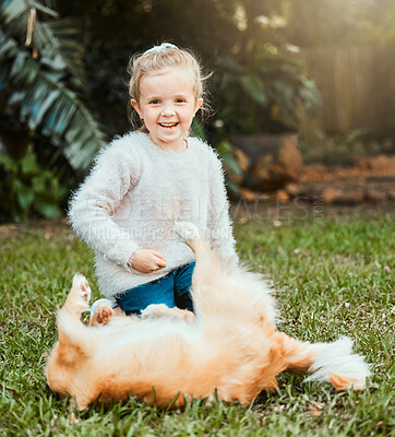 Buy stock photo Shot of an adorable young girl sitting outside and bonding with her dog