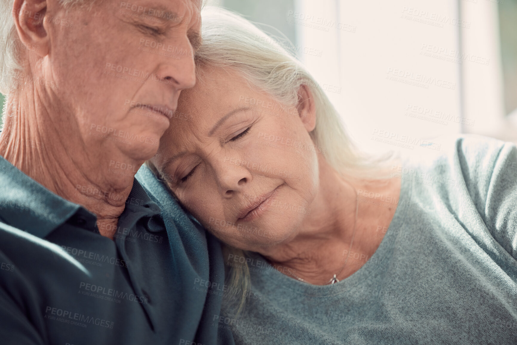 Buy stock photo Nap, relax and elderly couple hug in home, living room and bonding or sleeping together with support on sofa. Retirement, holiday and senior man with mature woman for love, peace or care in marriage
