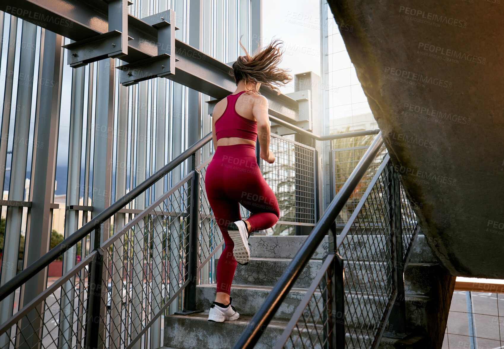 Buy stock photo Fitness, stairs and running with back of woman in city for challenge, health and cardio performance. Sports, workout and wellness with person and steps for marathon practice, training and runner