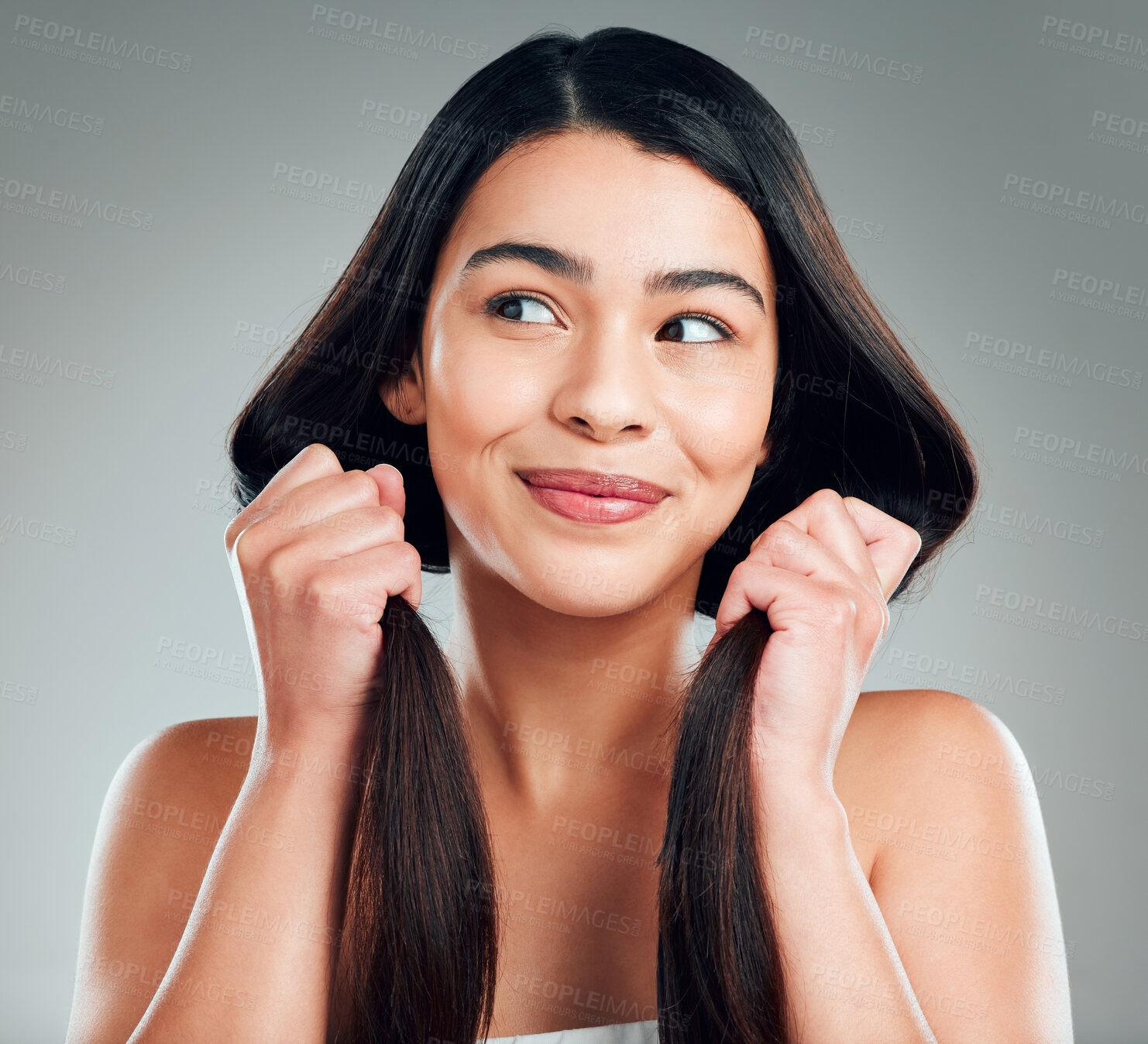 Buy stock photo Studio shot of a beautiful young woman with long brown hair