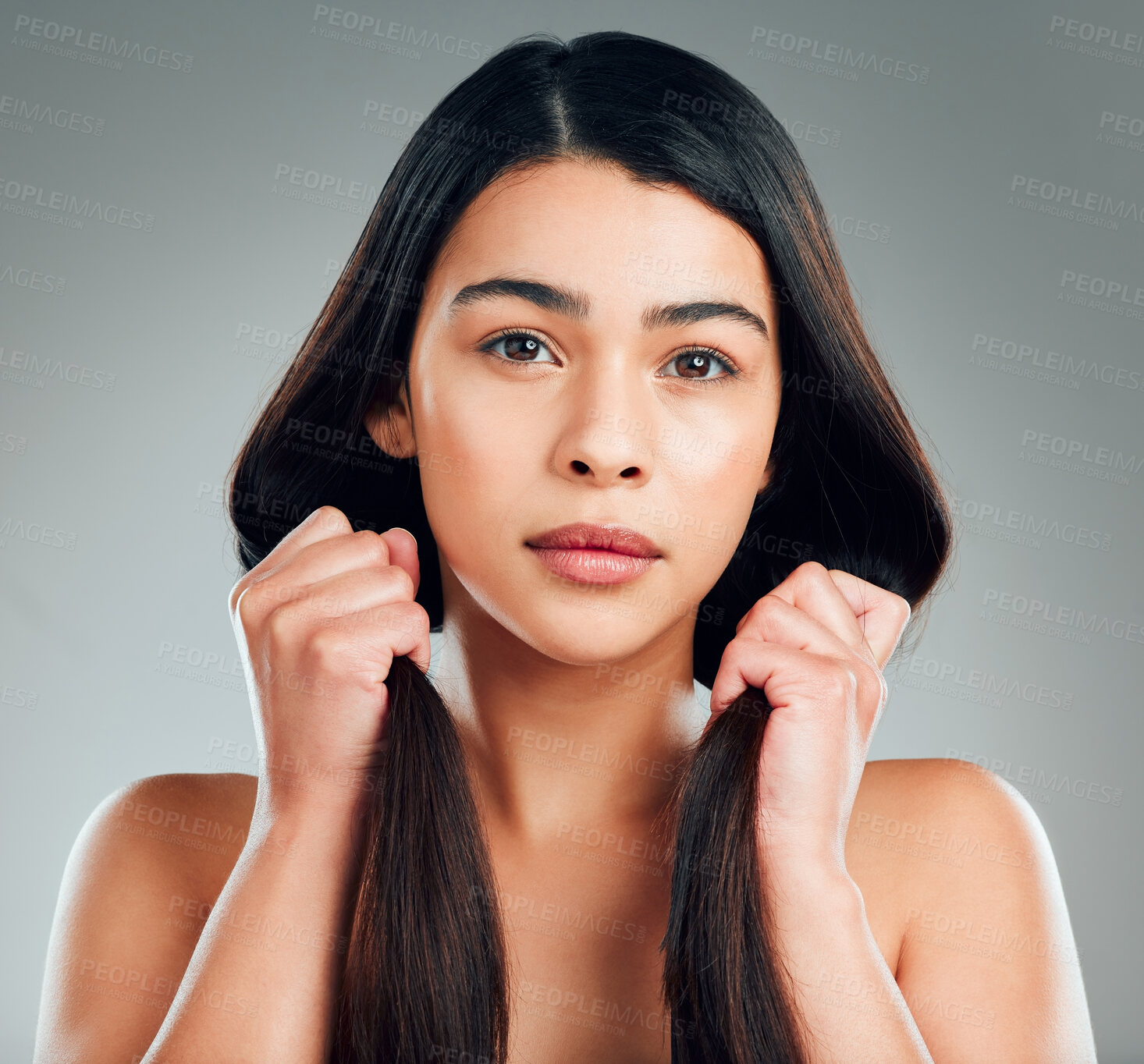 Buy stock photo Studio shot of a beautiful young woman with long brown hair