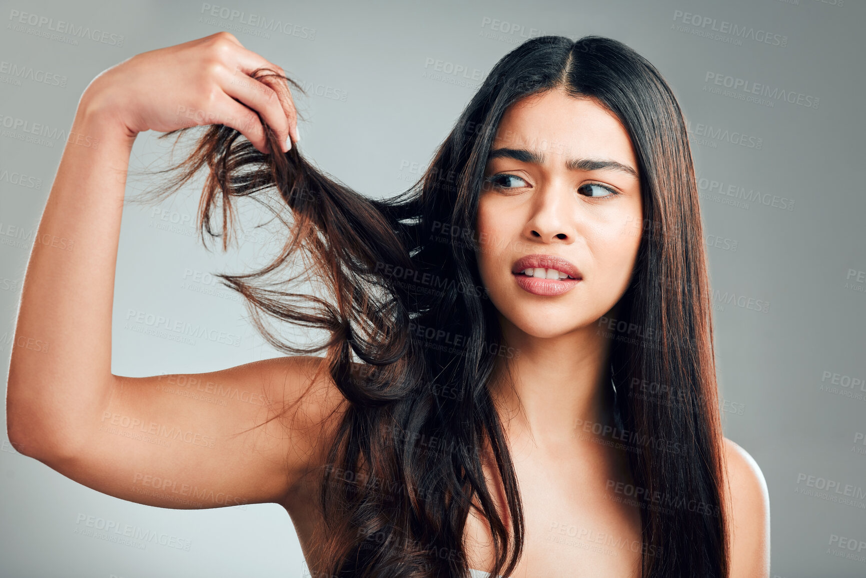 Buy stock photo Woman, hair care and stress with damage in studio, thinking and solution with split ends by background. Girl, model and frustrated with mistake, change and texture with mess, crisis and cosmetics