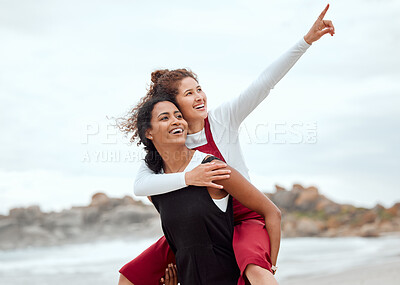 Buy stock photo Shot of a woman giving her friend a piggy back ride