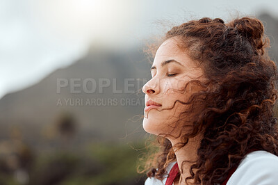 Buy stock photo Shot of a young woman standing on the beach