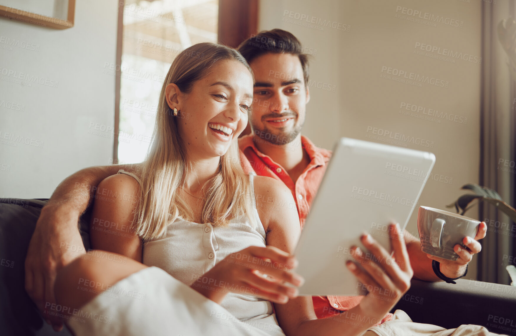 Buy stock photo Relax, coffee and couple on tablet on sofa online for social media, streaming movies and internet on weekend. Dating, happy and man and woman on digital tech for bonding, relationship or love in home