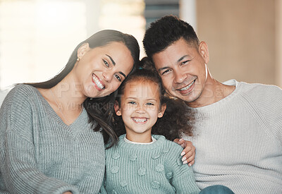 Buy stock photo Shot of a girl on a couch with her parents at home