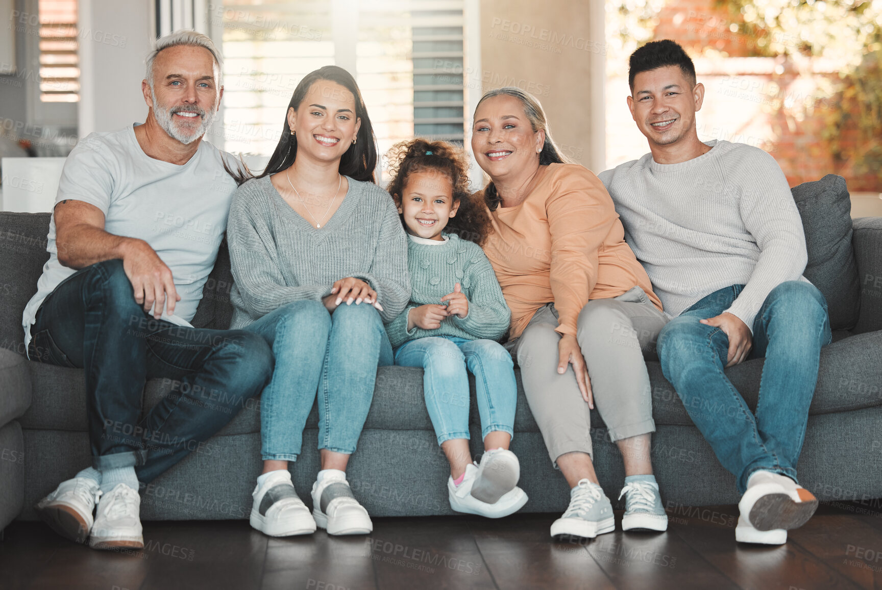 Buy stock photo Relax, portrait and family generations on sofa in home for bonding, security and pride. Smile, happy and girl child with parents and grandparents in living room for care, love or connection at house.