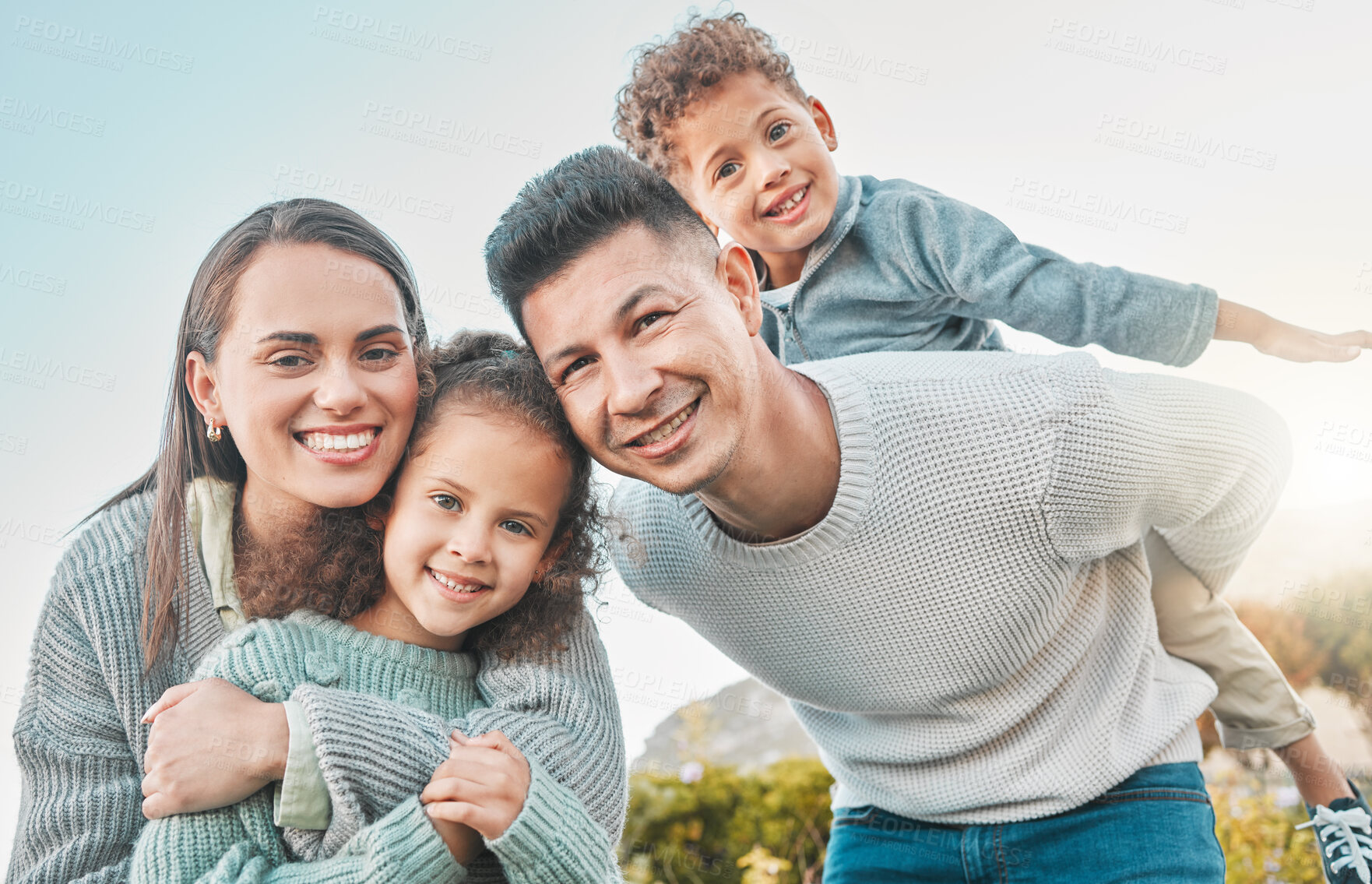 Buy stock photo Parents, kids and happy in garden with piggyback on portrait for fun, bonding and support in Brazil. People, family and smile outdoor at home on break to relax, rest and chill for care and love