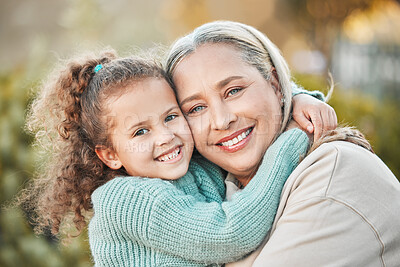 Buy stock photo Shot of a grandmother and grandchild spending time together in the garden at home