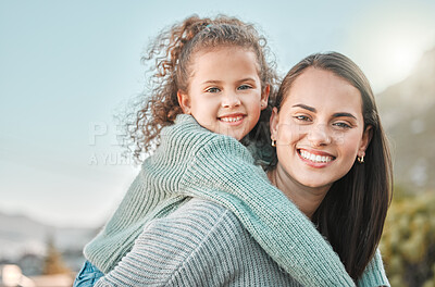 Buy stock photo Shot of a little girl spending the day outdoors with her mother