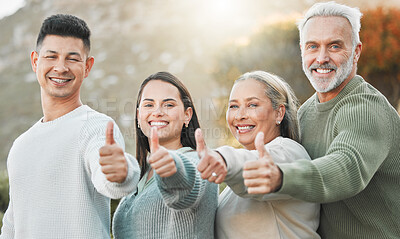 Buy stock photo Shot of a family showing thumbs up outside