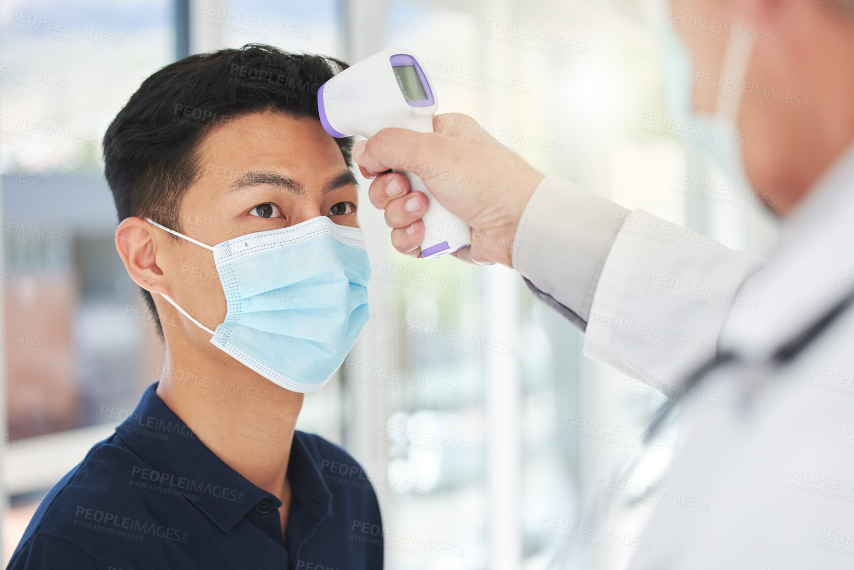 Buy stock photo Doctor, man and face mask with thermometer, healthcare and vaccine for growth or development in clinic. Male person, physician and temperature at hospital for symptoms, checkup and disease prevention