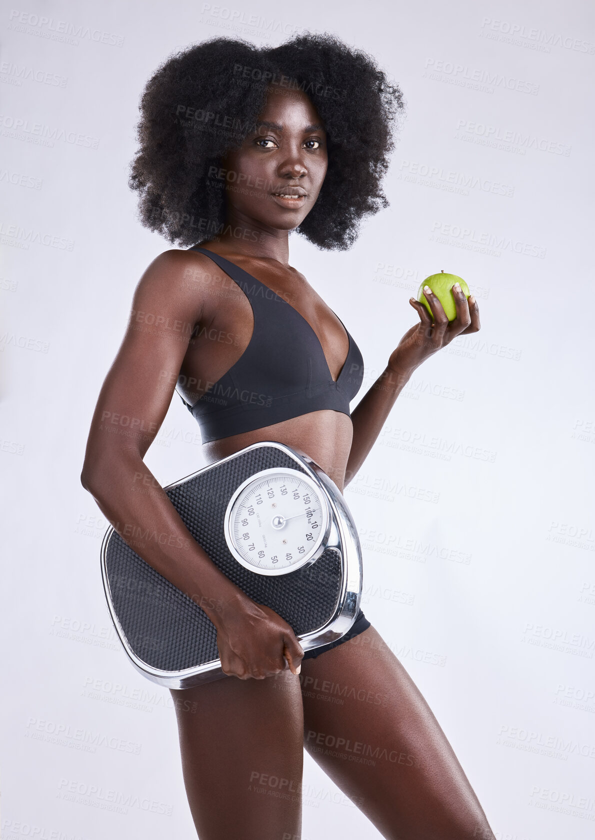 Buy stock photo Fitness, scale and black woman portrait with apple in studio for wellness, gut health and diet, detox or balance on white background. Body, care and model with organic, fruit or weight loss progress