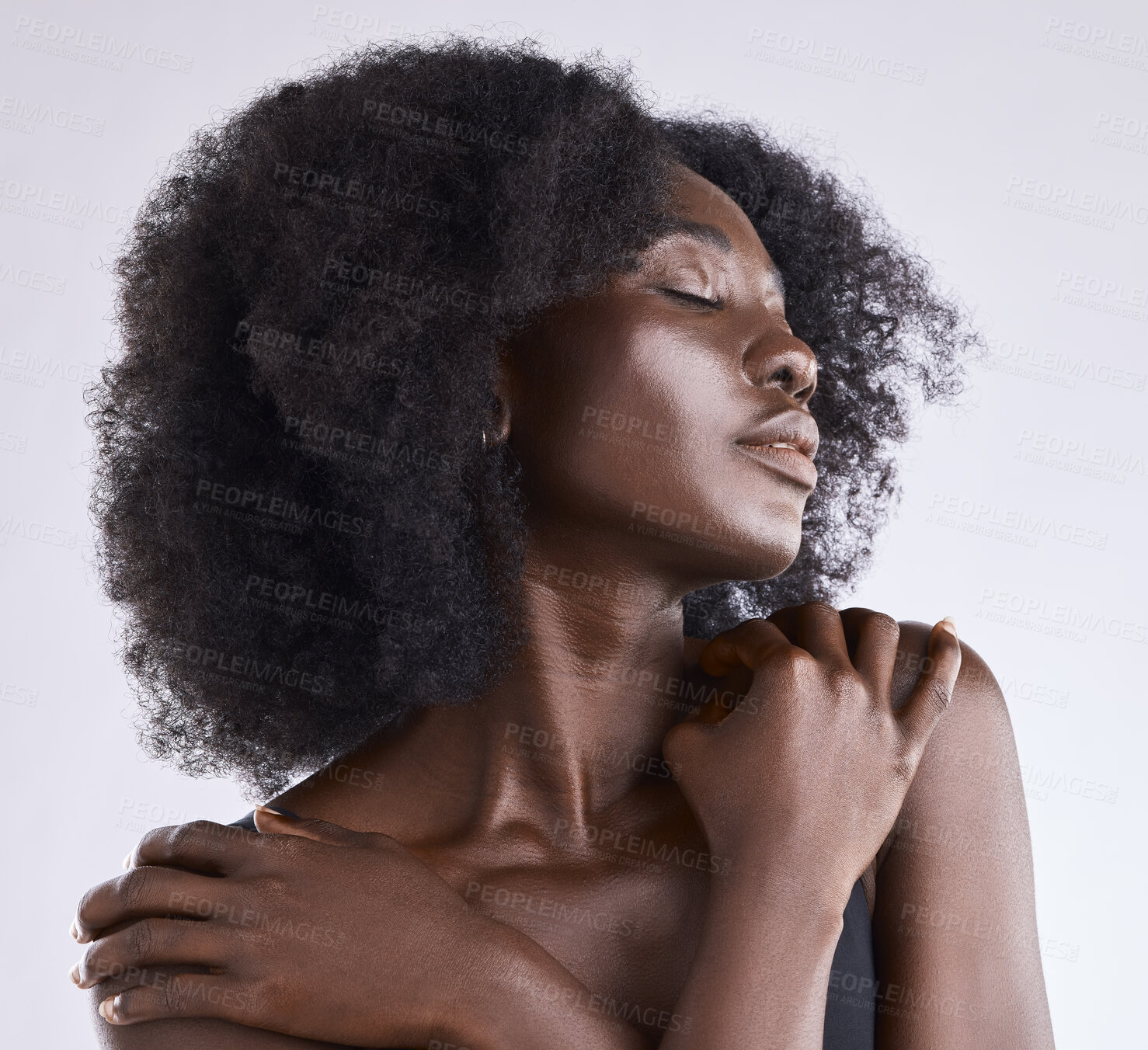 Buy stock photo African woman, beauty and skincare with relax and afro hair in a studio with dermatology. Wellness, skin care and natural cosmetics of a African female model with white background and hairstyle