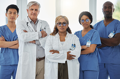 Buy stock photo Leadership portrait, serious and doctors with arms crossed standing together in hospital. Face, teamwork and confident medical professionals, surgeon group or nurses with collaboration for healthcare