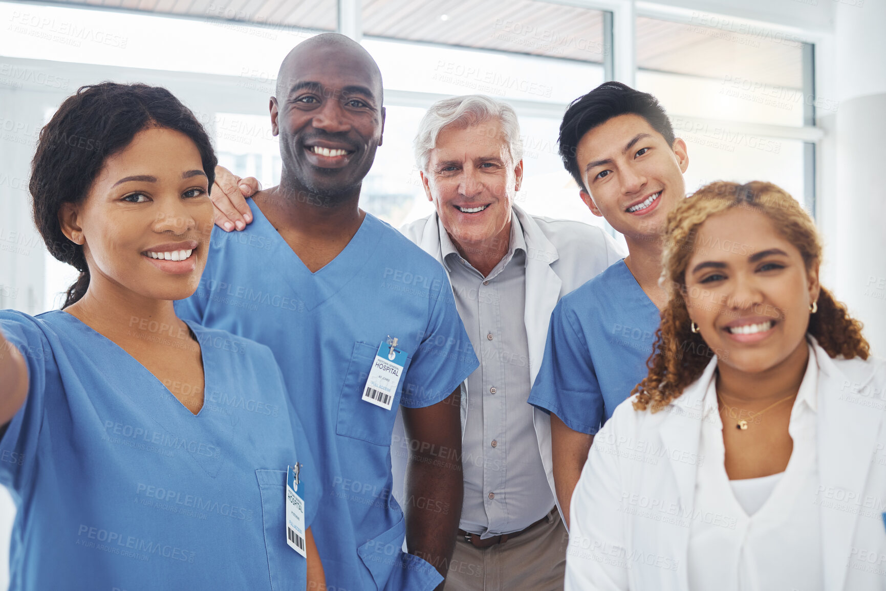 Buy stock photo Selfie, portrait or doctors in hospital for healthcare, professional or pride with diversity. Medical specialist, surgery or team with smile for synergy, collaboration or support in solidarity