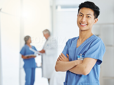 Buy stock photo Portrait, nurse and Asian man with arms crossed in hospital or clinic for healthcare. Face, confidence and happy medical professional, surgeon and doctor with pride for career, job and wellness.